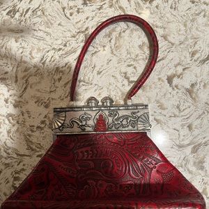 Moulin Rouge leather purse, red and black design, pewter clasp. Great condition!